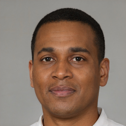 Neutral black young-adult male with short  black hair and brown eyes