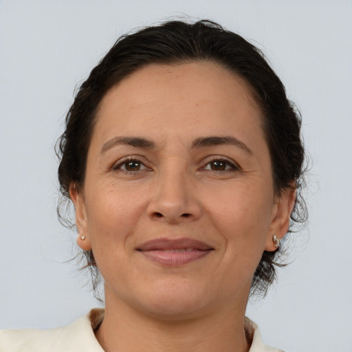 Joyful white adult female with medium  brown hair and brown eyes