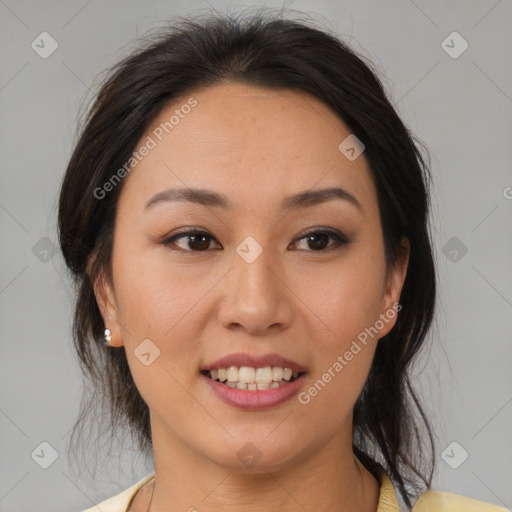 Joyful latino young-adult female with medium  brown hair and brown eyes