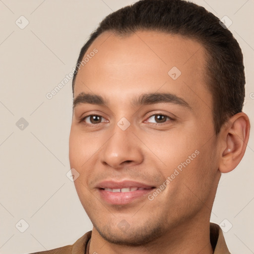 Joyful white young-adult male with short  brown hair and brown eyes