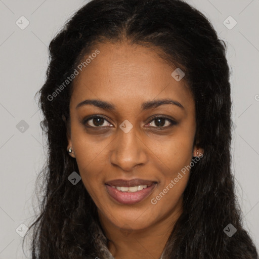 Joyful black young-adult female with long  brown hair and brown eyes