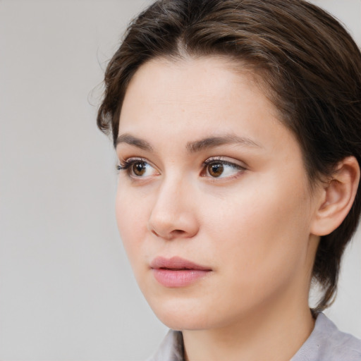 Neutral white young-adult female with medium  brown hair and brown eyes