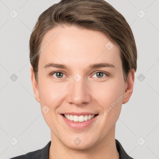 Joyful white young-adult female with short  brown hair and grey eyes