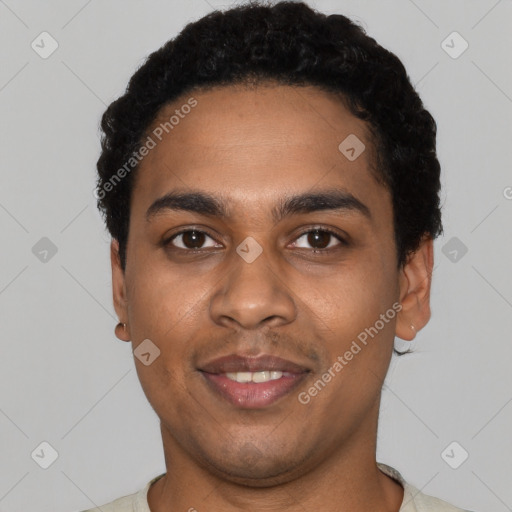 Joyful black young-adult male with short  black hair and brown eyes