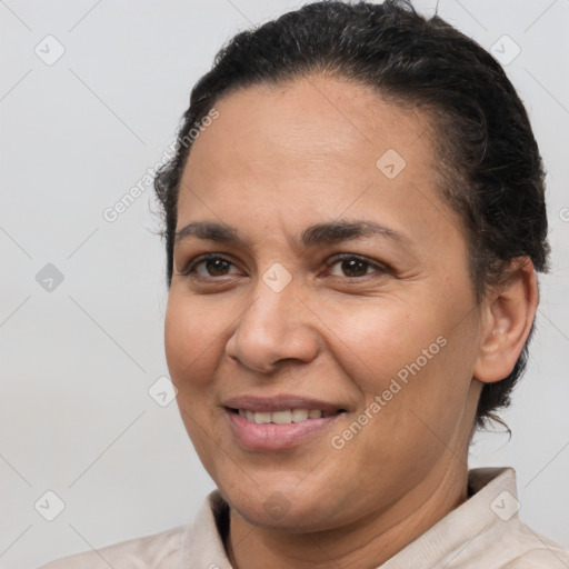 Joyful white adult female with short  brown hair and brown eyes