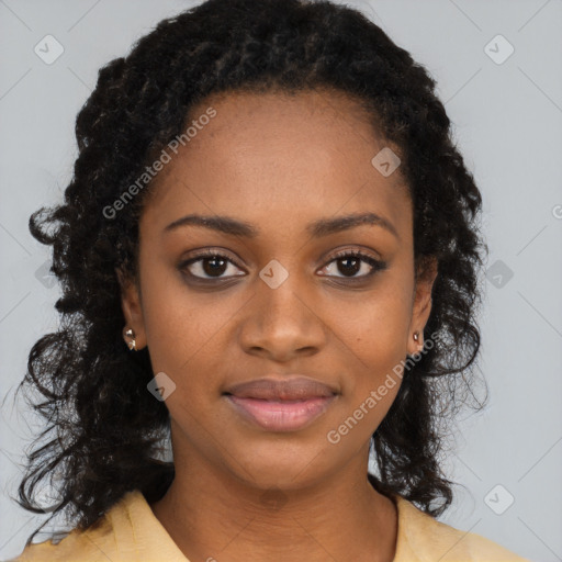 Joyful black young-adult female with long  brown hair and brown eyes