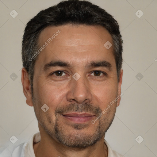 Joyful white adult male with short  black hair and brown eyes