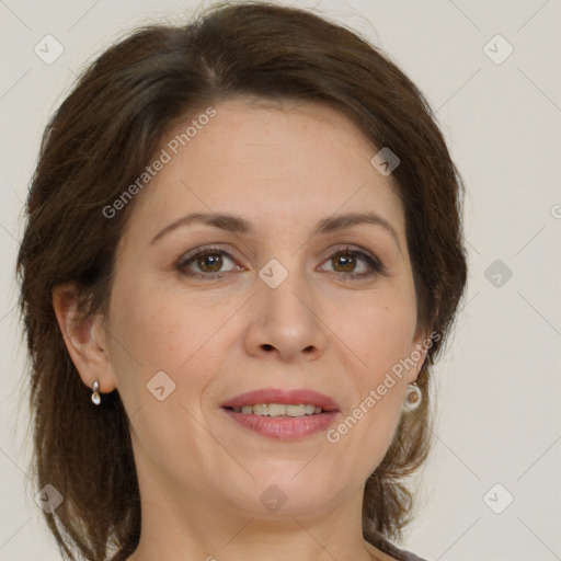 Joyful white adult female with medium  brown hair and brown eyes