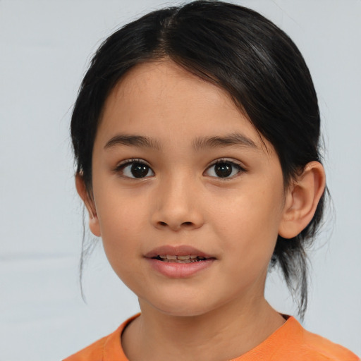 Joyful asian child female with medium  brown hair and brown eyes