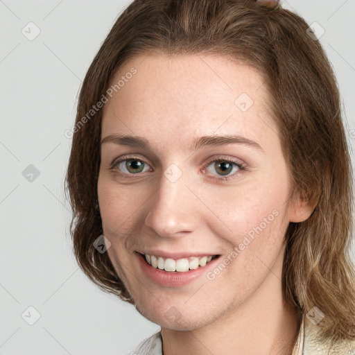 Joyful white young-adult female with medium  brown hair and green eyes