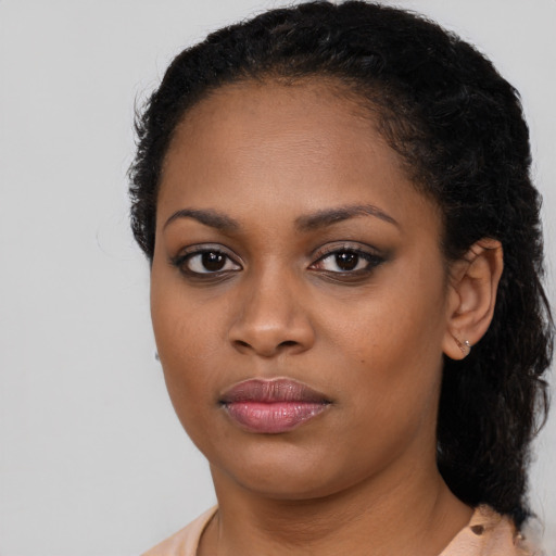 Neutral black young-adult female with medium  black hair and brown eyes