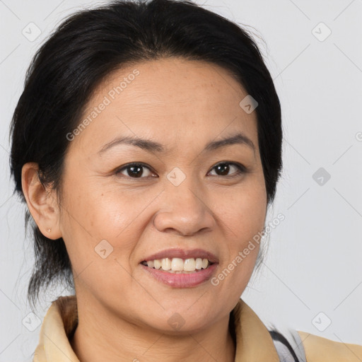 Joyful latino adult female with medium  brown hair and brown eyes