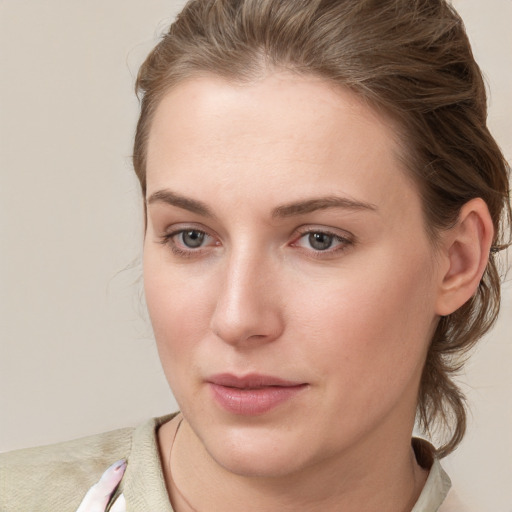 Neutral white young-adult female with medium  brown hair and grey eyes