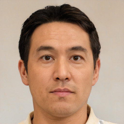Neutral white adult male with short  black hair and brown eyes