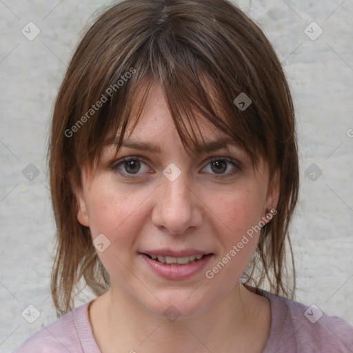 Joyful white young-adult female with medium  brown hair and blue eyes