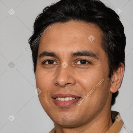 Joyful white adult male with short  brown hair and brown eyes