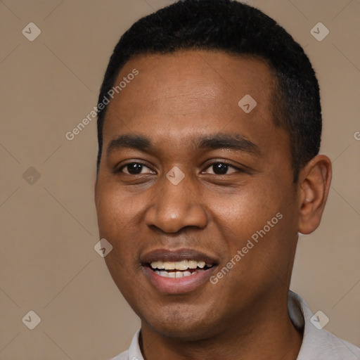 Joyful black young-adult male with short  black hair and brown eyes