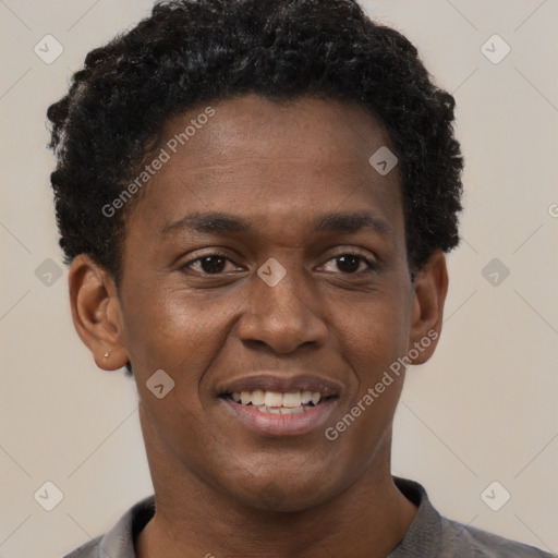 Joyful black young-adult male with short  black hair and brown eyes