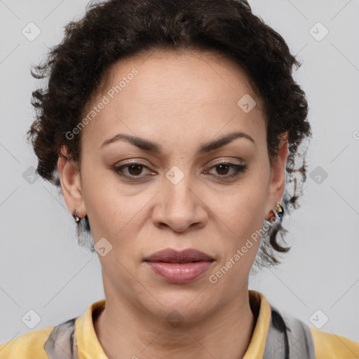 Joyful latino adult female with medium  brown hair and brown eyes