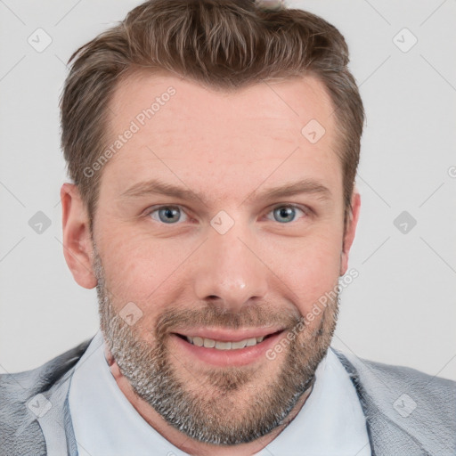 Joyful white young-adult male with short  brown hair and blue eyes