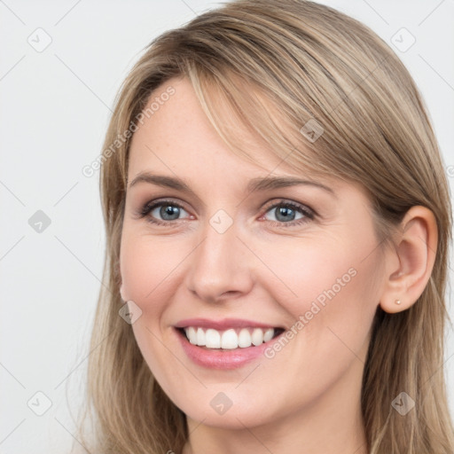 Joyful white young-adult female with long  brown hair and grey eyes