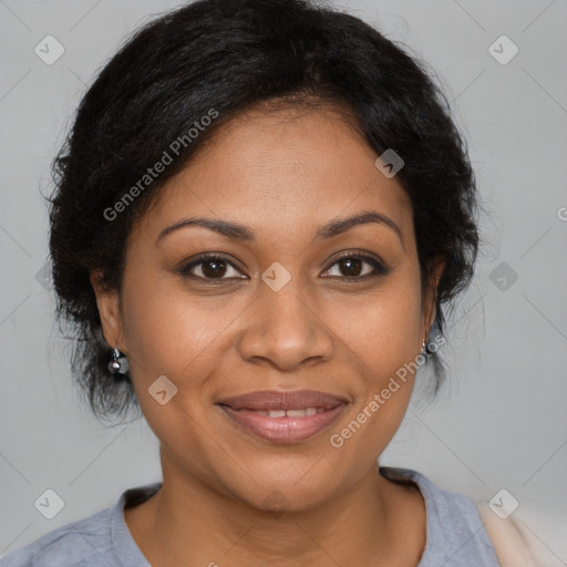 Joyful black adult female with medium  brown hair and brown eyes