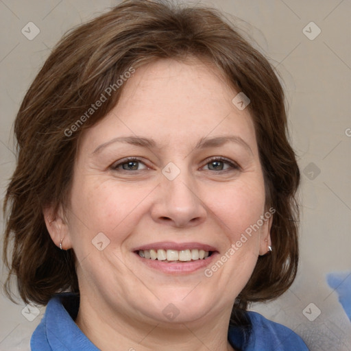 Joyful white adult female with medium  brown hair and grey eyes