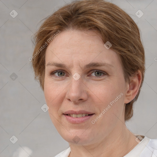 Joyful white adult female with short  brown hair and grey eyes