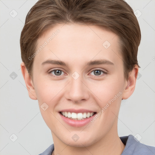 Joyful white young-adult female with short  brown hair and grey eyes