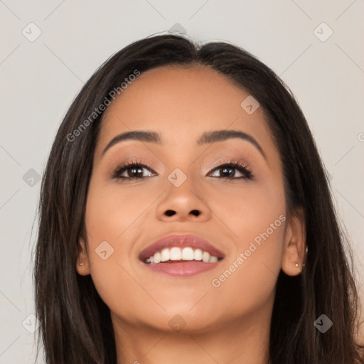 Joyful latino young-adult female with long  black hair and brown eyes