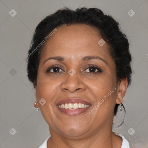 Joyful black adult female with short  brown hair and brown eyes