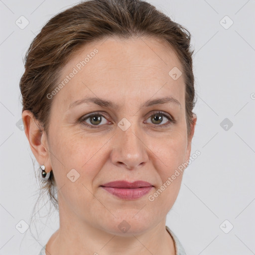 Joyful white adult female with short  brown hair and grey eyes