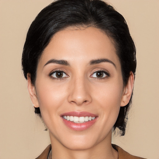 Joyful white young-adult female with medium  black hair and brown eyes