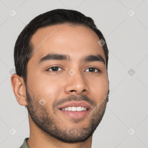 Joyful latino young-adult male with short  brown hair and brown eyes