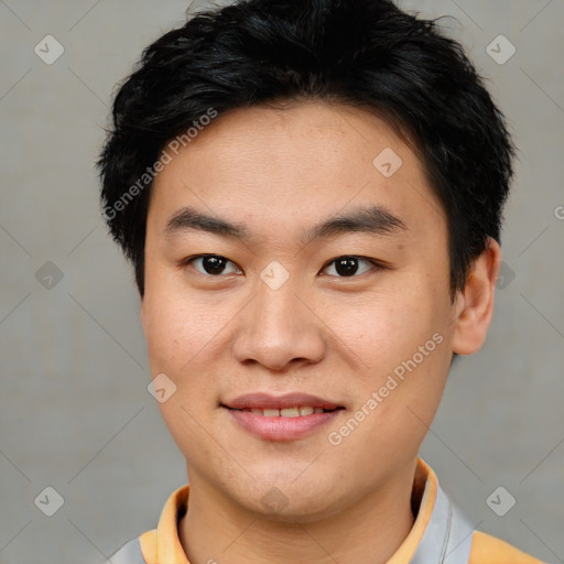 Joyful asian young-adult male with short  brown hair and brown eyes