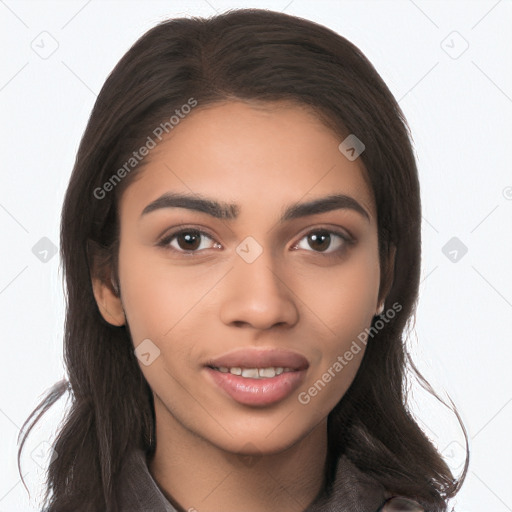 Joyful latino young-adult female with long  brown hair and brown eyes