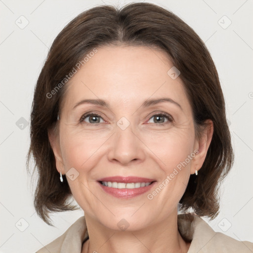 Joyful white adult female with medium  brown hair and grey eyes