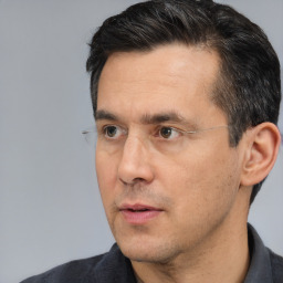 Neutral white adult male with short  black hair and brown eyes