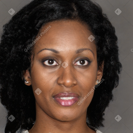 Joyful black young-adult female with long  black hair and brown eyes