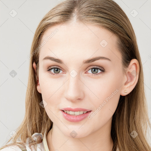 Joyful white young-adult female with long  brown hair and blue eyes