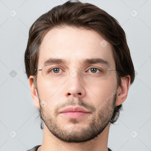 Neutral white young-adult male with short  brown hair and brown eyes