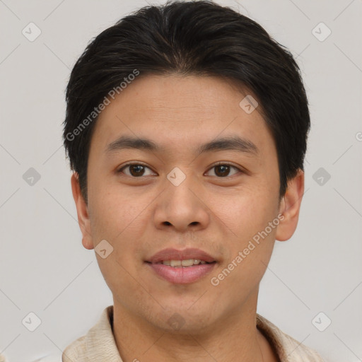 Joyful asian young-adult male with short  brown hair and brown eyes