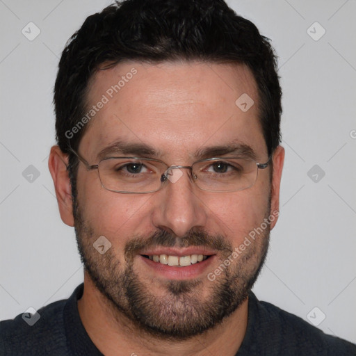 Joyful white adult male with short  black hair and brown eyes