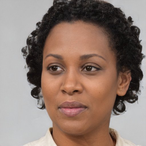Neutral black young-adult female with short  brown hair and brown eyes