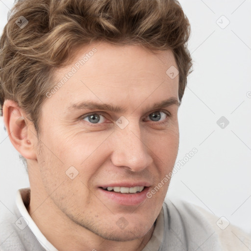 Joyful white adult male with short  brown hair and grey eyes