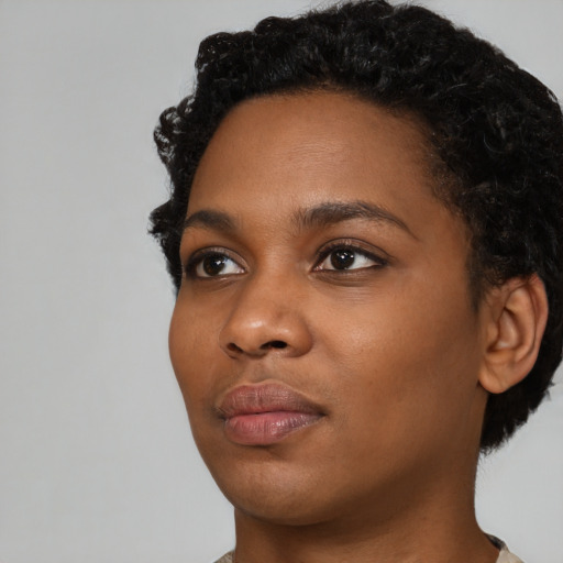 Neutral black young-adult female with short  black hair and brown eyes