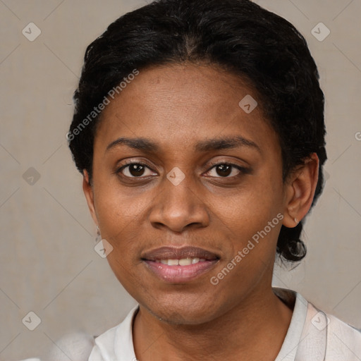 Joyful black young-adult female with short  black hair and brown eyes