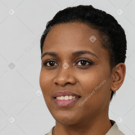 Joyful black young-adult female with short  black hair and brown eyes