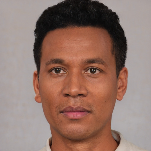 Neutral latino adult male with short  black hair and brown eyes