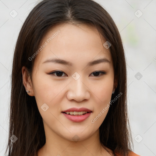 Joyful asian young-adult female with long  brown hair and brown eyes